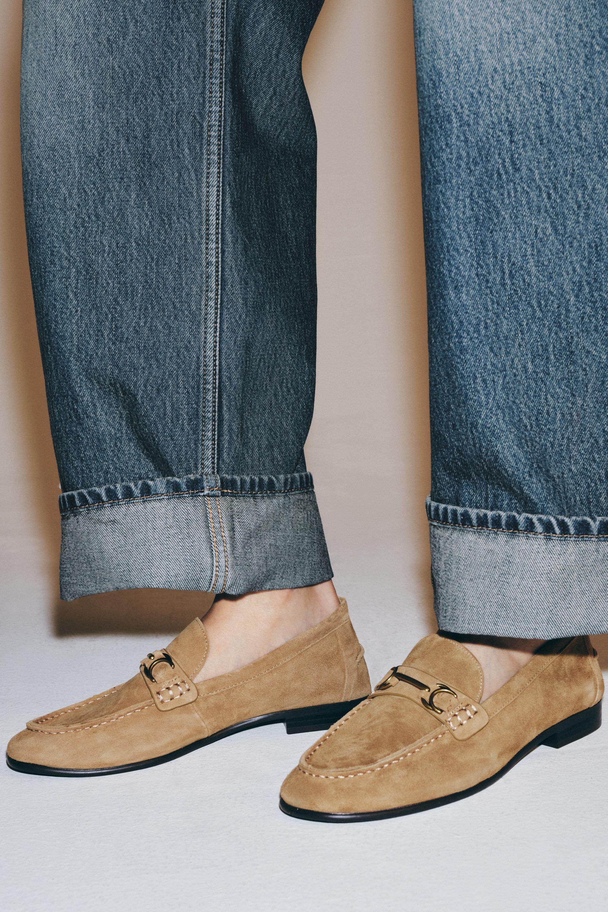 SUEDE LOAFERS WITH METALLIC APPLIQUÉ